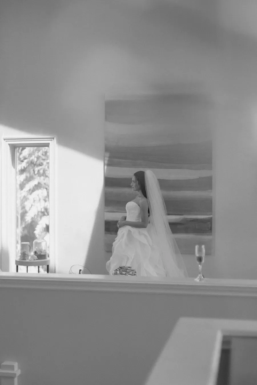 Bride adjusting her jewelry in a bright room — David and Katia wedding