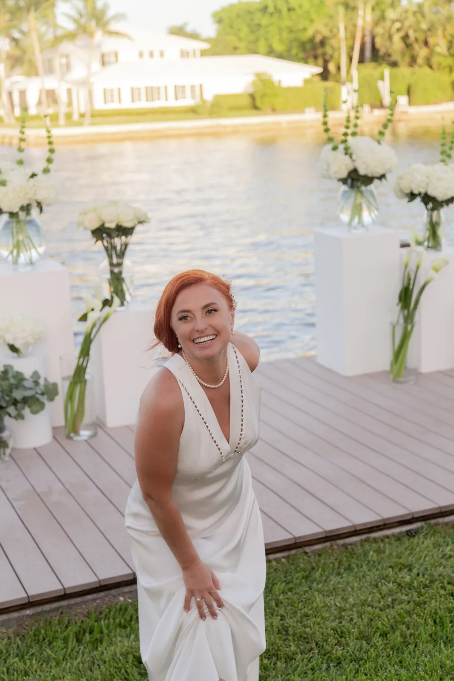 Newlyweds walking hand in hand by the water — Alexander and Olga wedding