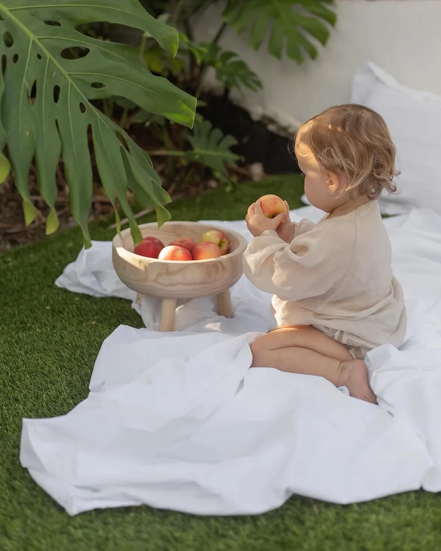 Mother and child sharing a picnic on the grass