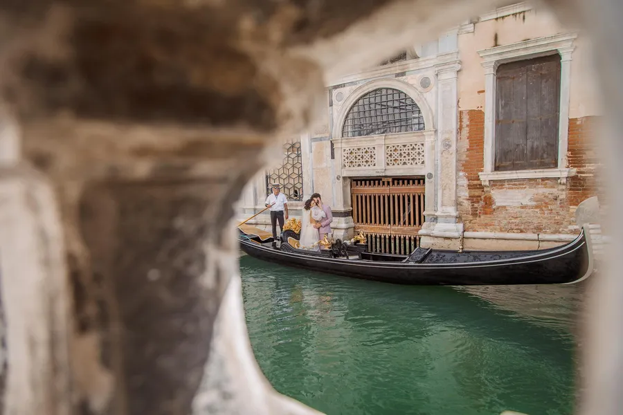 Canal view framed by weathered Venetian architecture