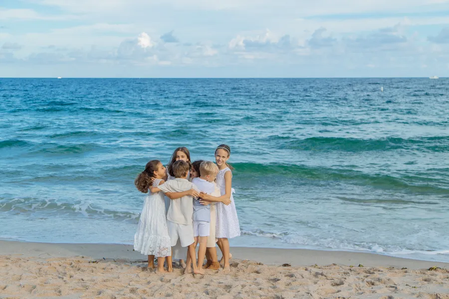 Bride and groom sharing a joyful beach portrait — Roman and Victoria wedding