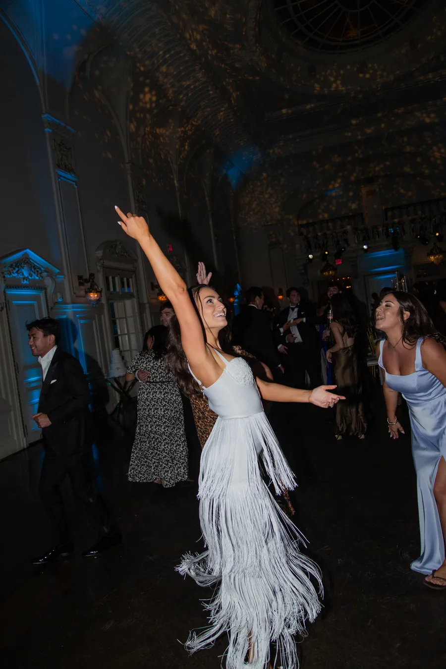 Bride and groom dancing beneath warm reception lights — David and Katia wedding