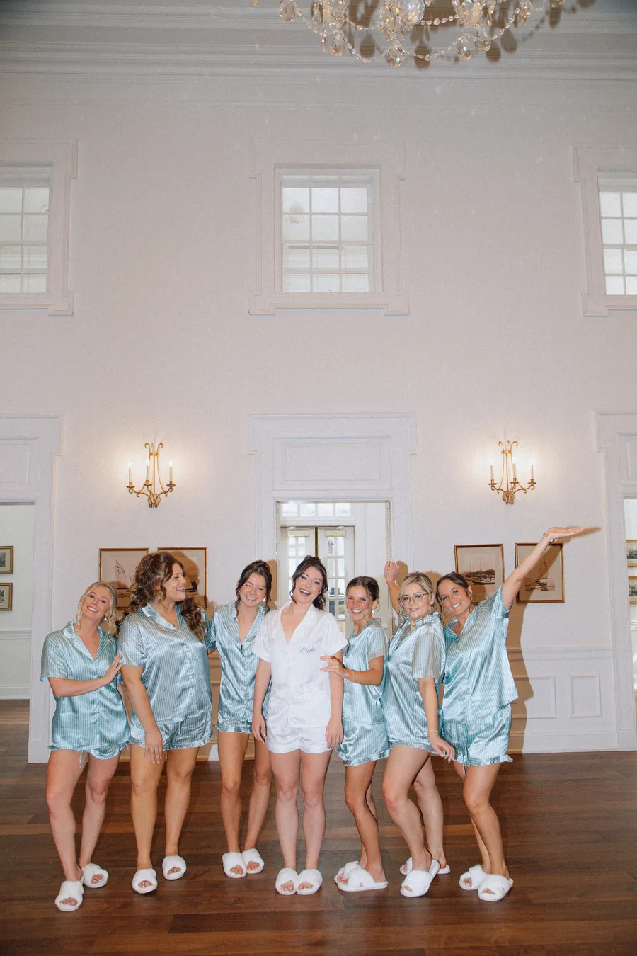 Bridesmaids celebrating together inside a bright room