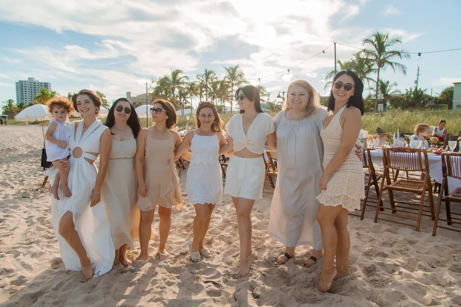 Family and friends gathering for an oceanfront wedding — Roman and Victoria wedding