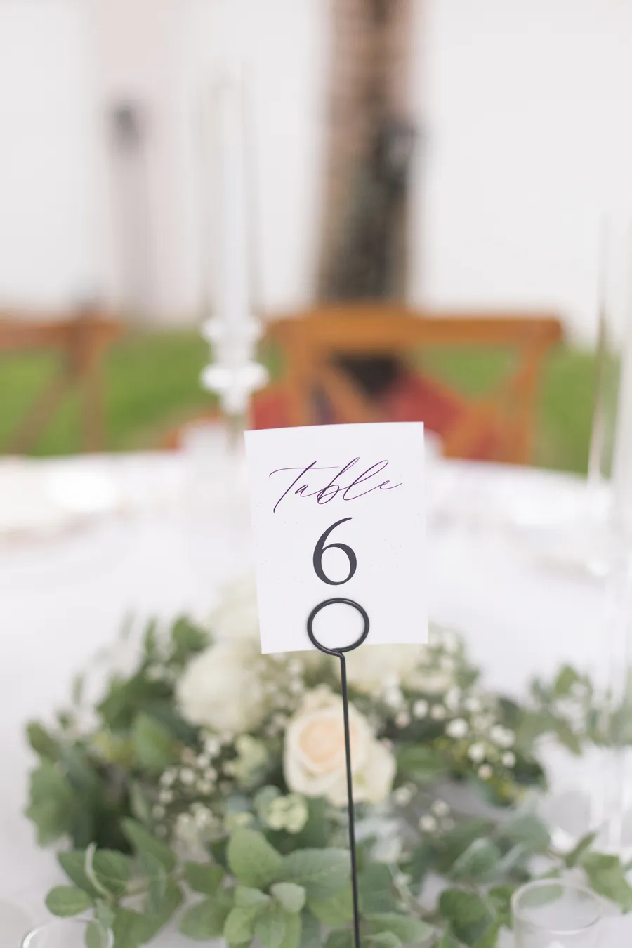 Outdoor ceremony aisle prepared beneath tropical trees — Chris and Laura wedding