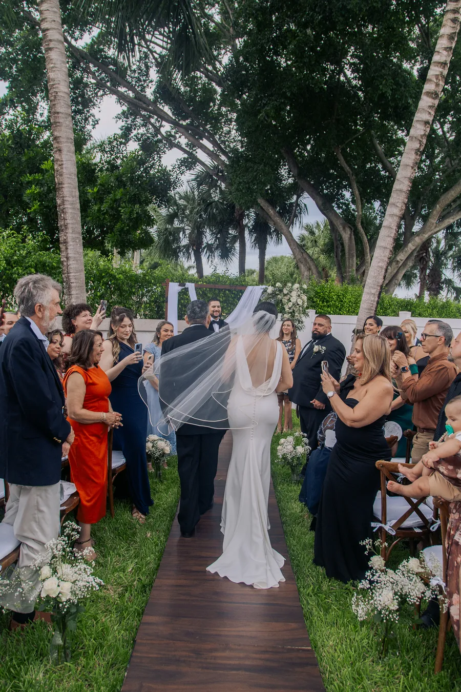 Guests seated for an intimate outdoor wedding ceremony — Chris and Laura wedding