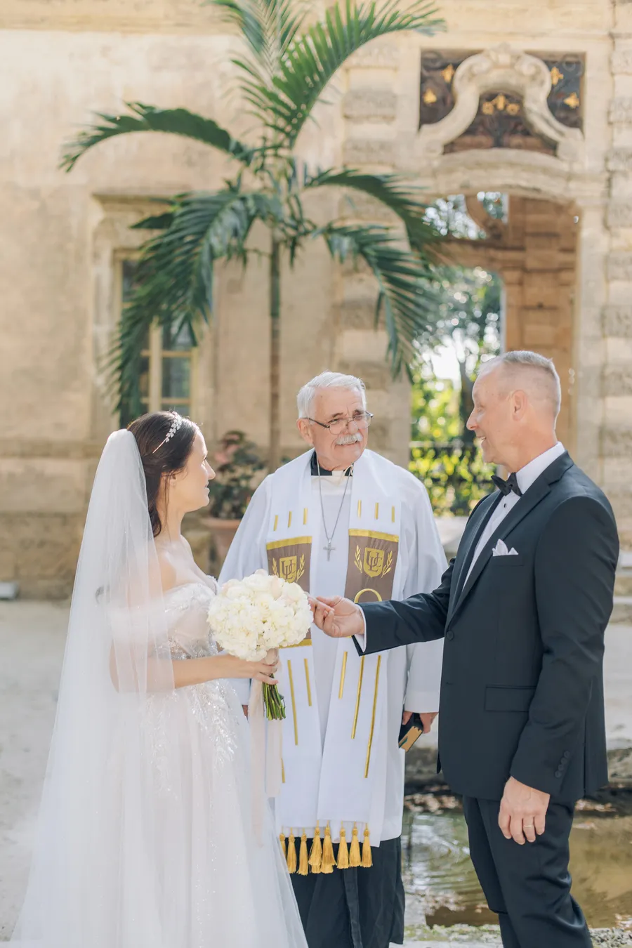 Close detail of the couple exchanging rings — Steven and Iryna wedding