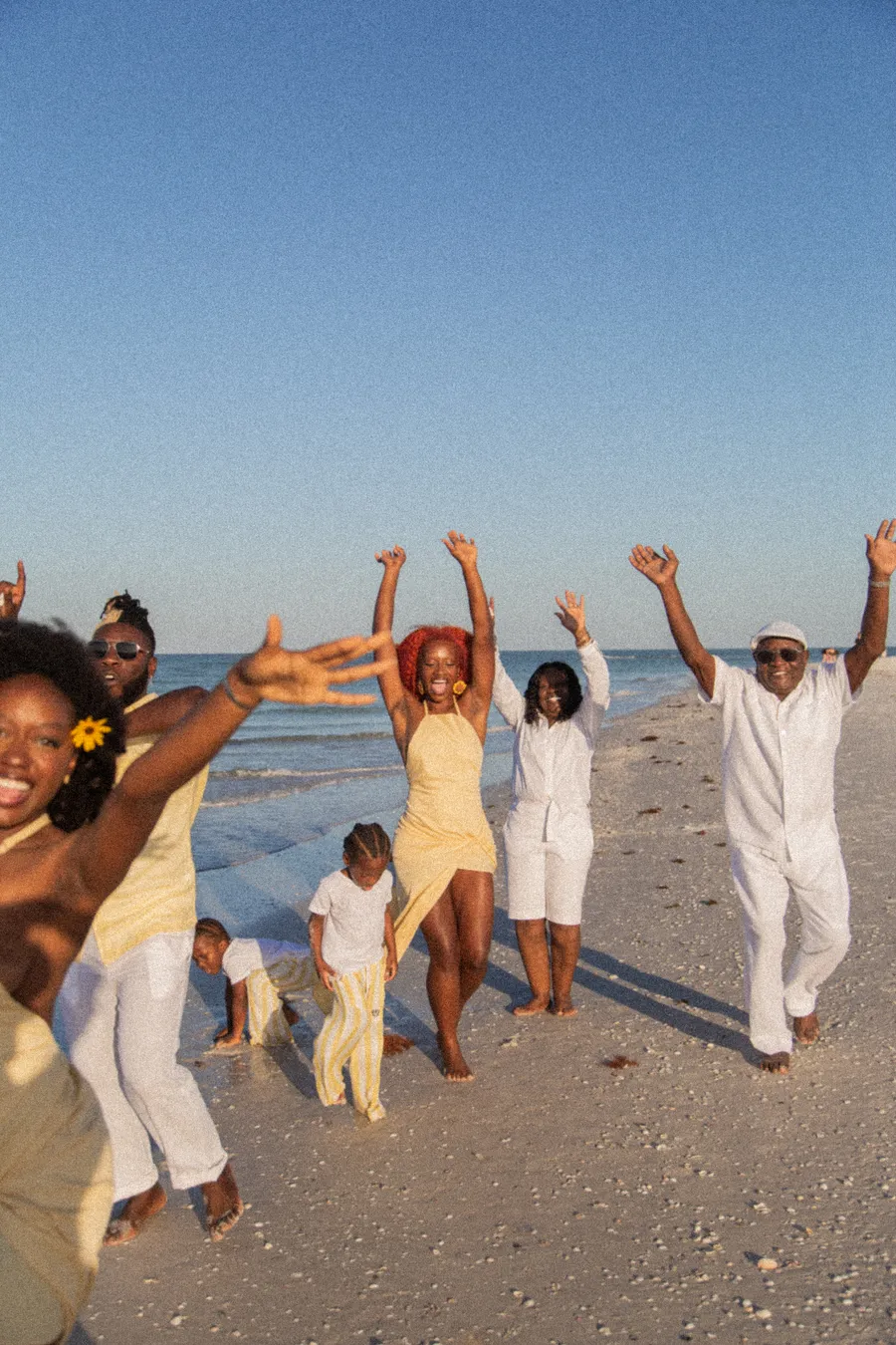 Extended family celebrating together during a beach photo session