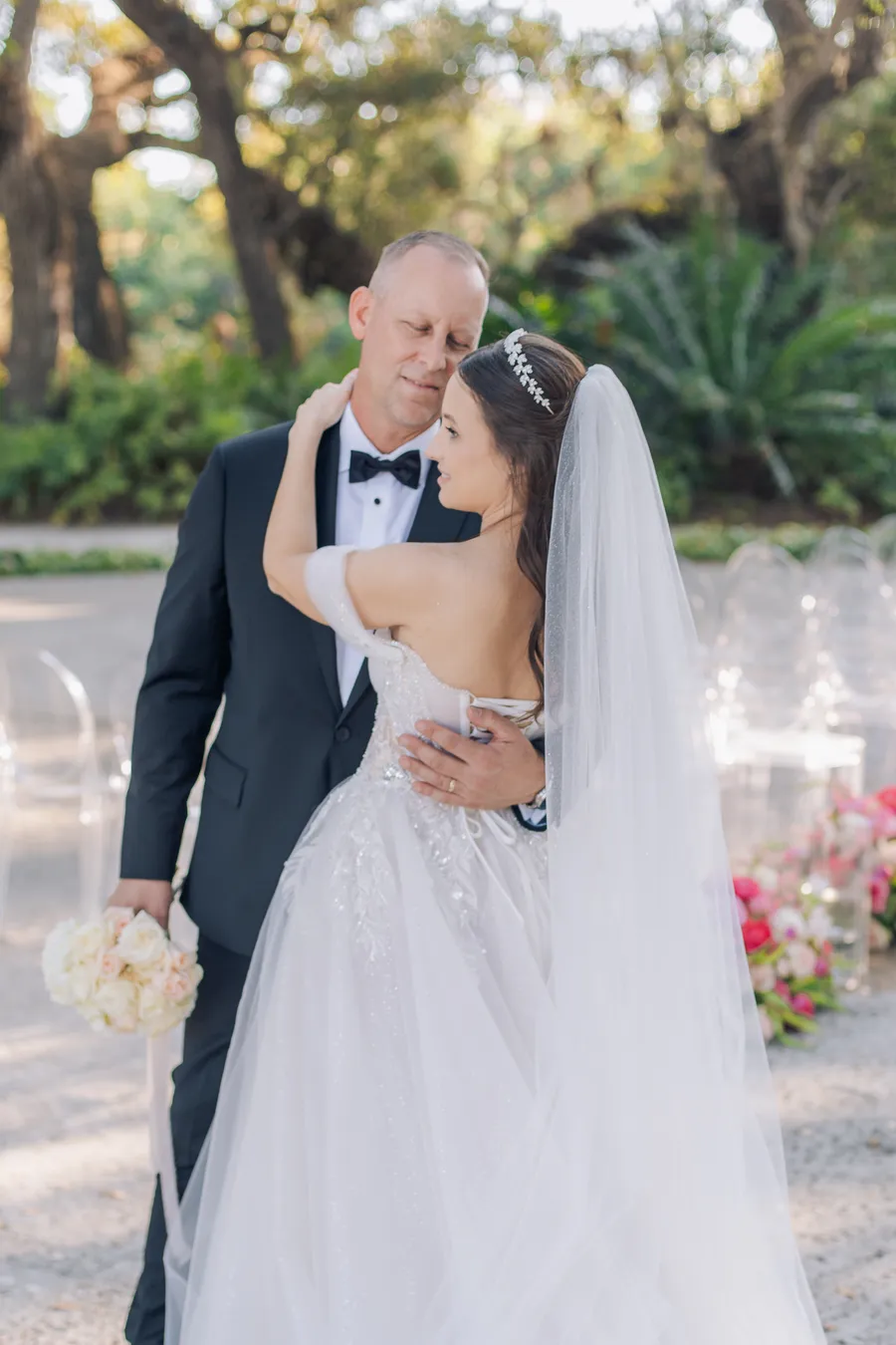 White bridal bouquet resting beside the wedding dress — Steven and Iryna wedding