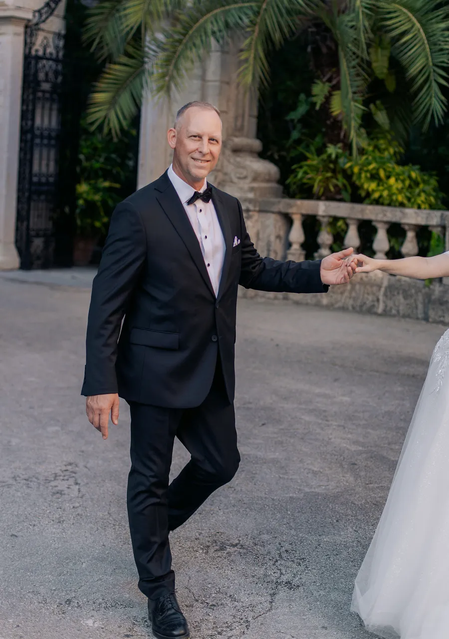 Newlyweds walking through tropical garden grounds — Steven and Iryna wedding