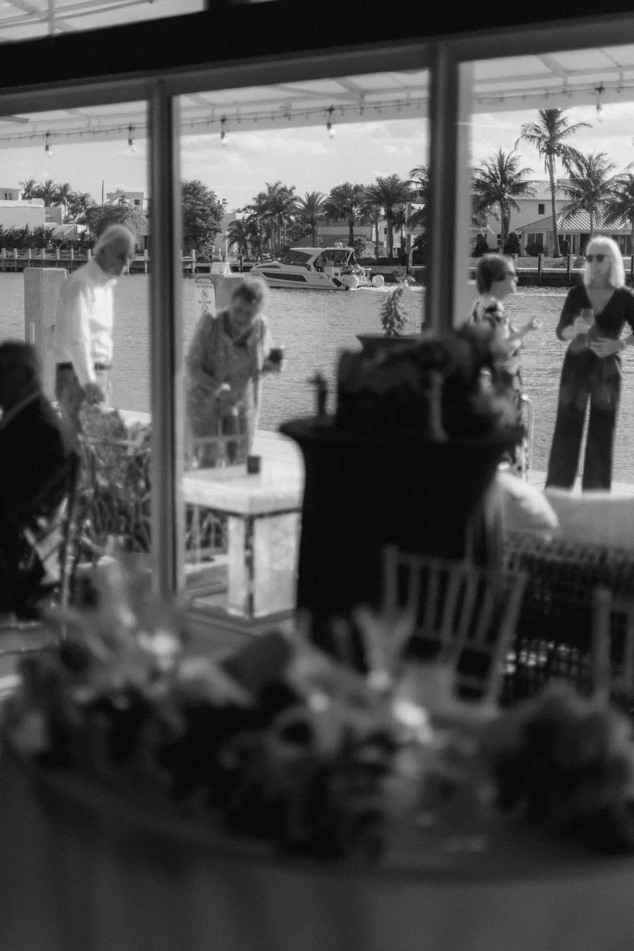 Black-and-white wedding ceremony beneath a covered pavilion
