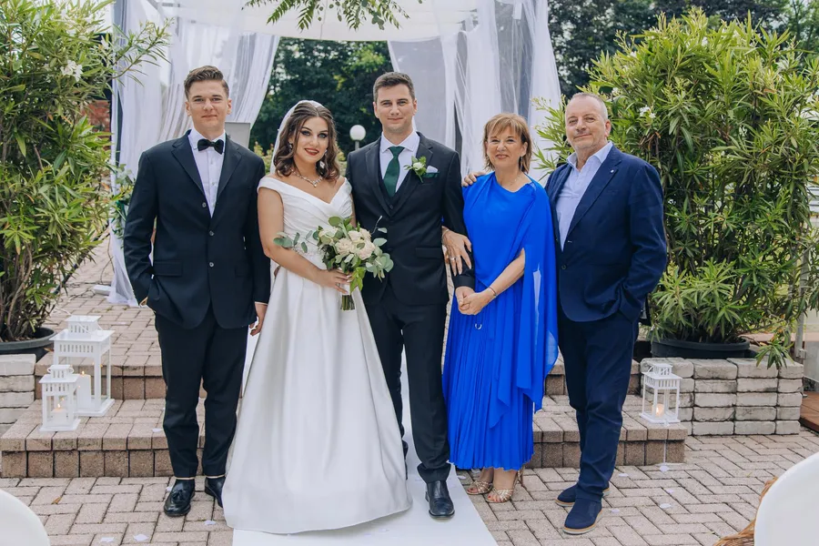 Groom and friends sharing a candid outdoor moment — Mattia and Yulia wedding