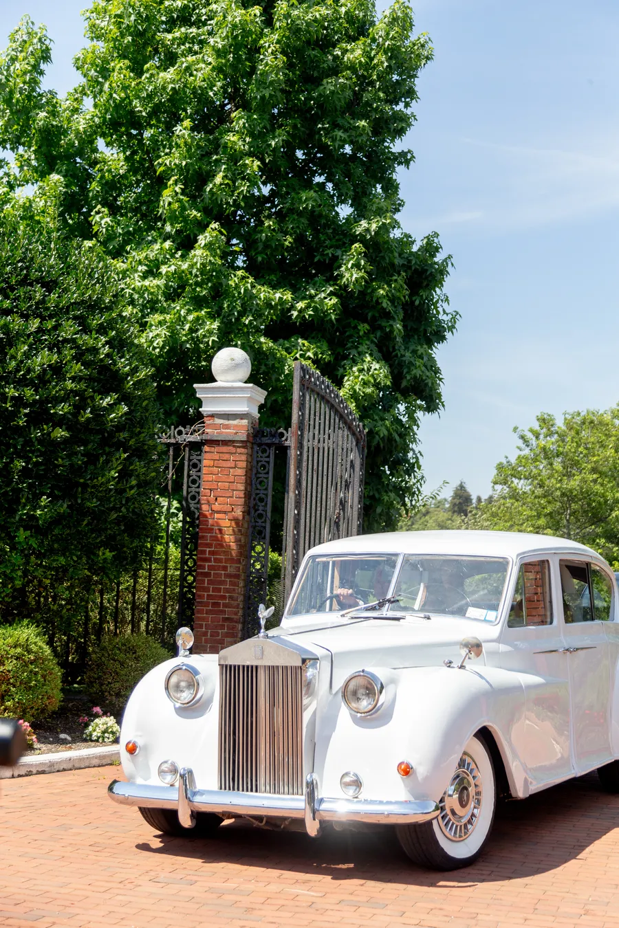 Classic white wedding car outside a grand estate — David and Katia wedding