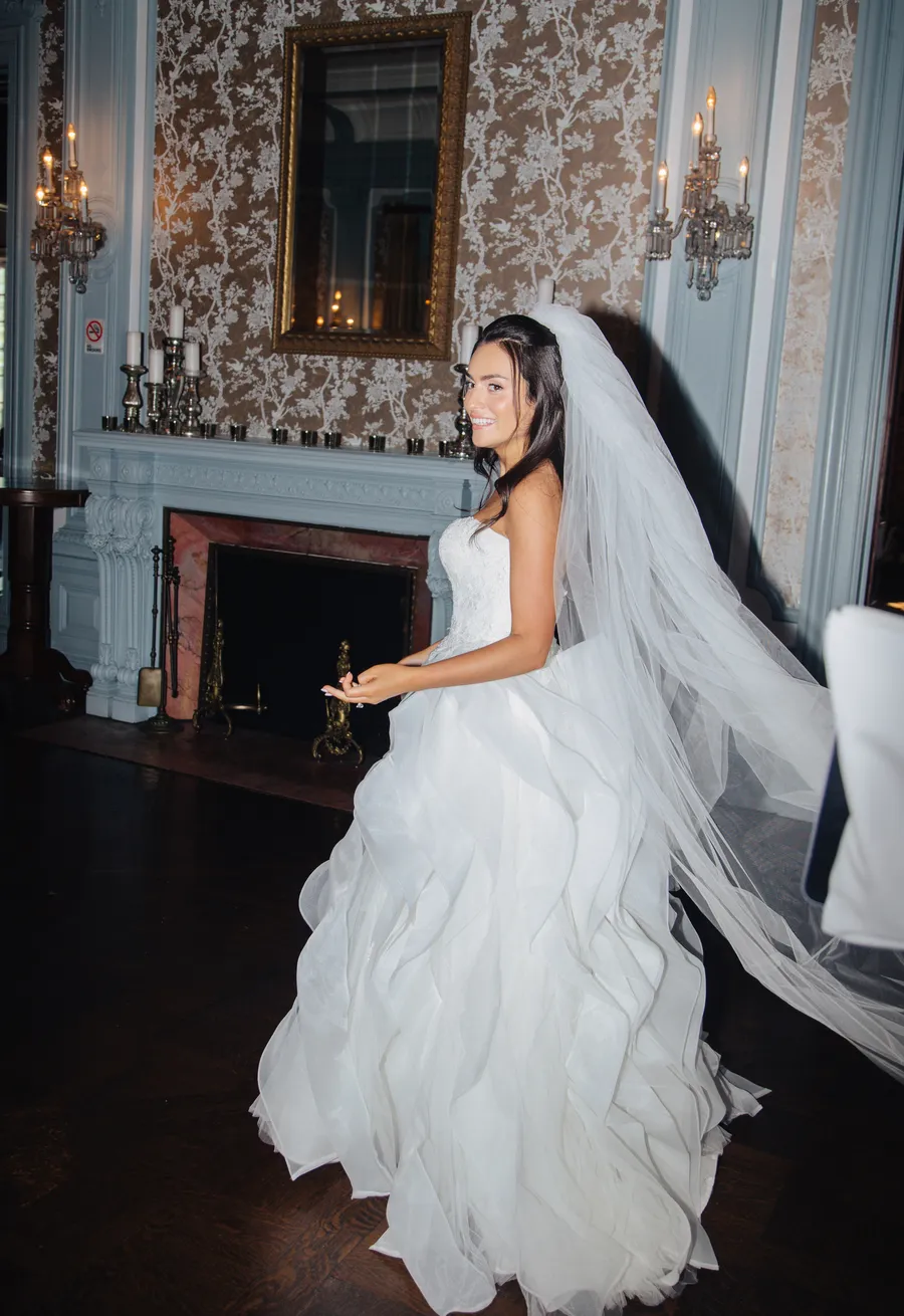 Bride posing with bridesmaids in pale blue dresses — David and Katia wedding