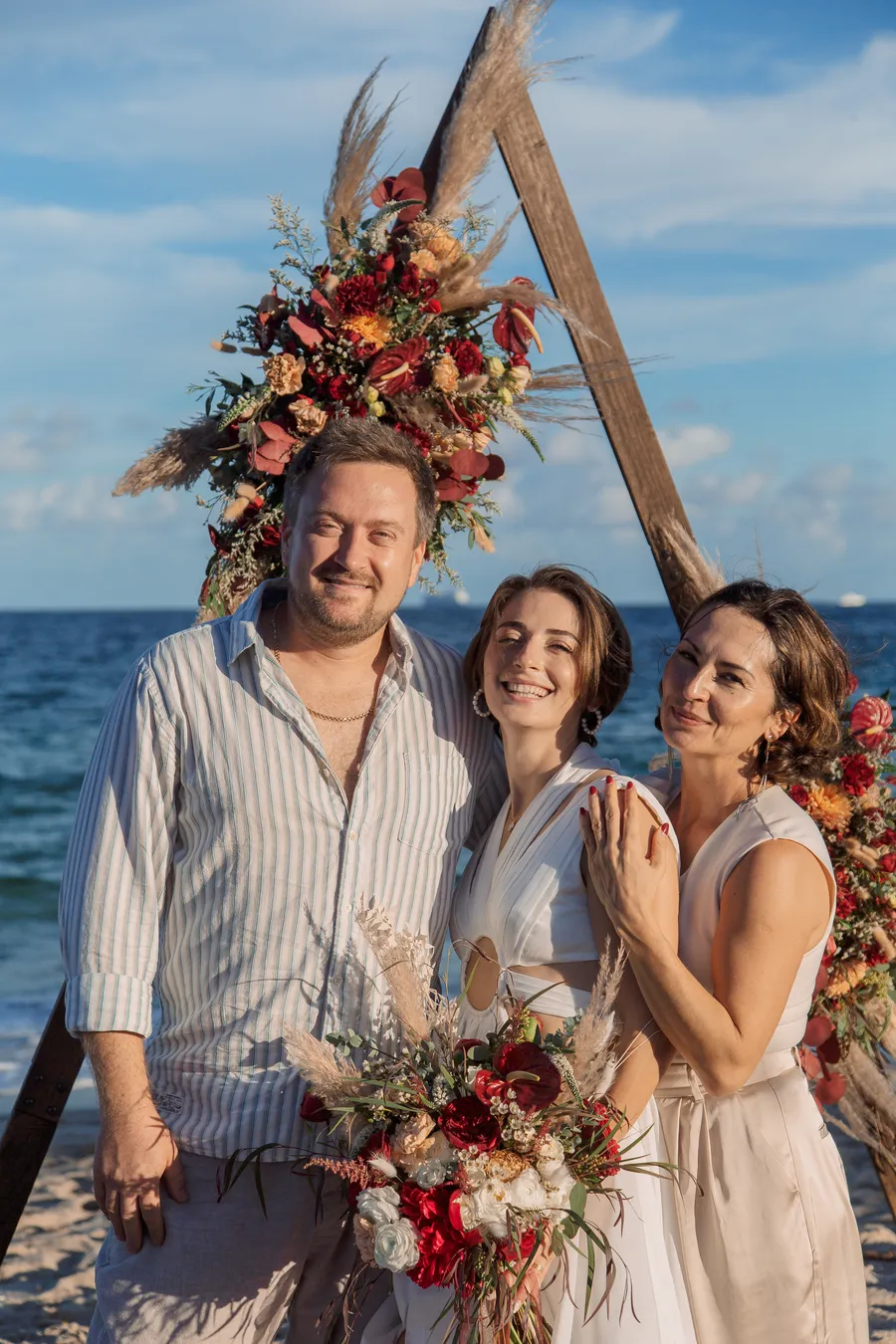 Large wedding group portrait beside the ocean — Roman and Victoria wedding