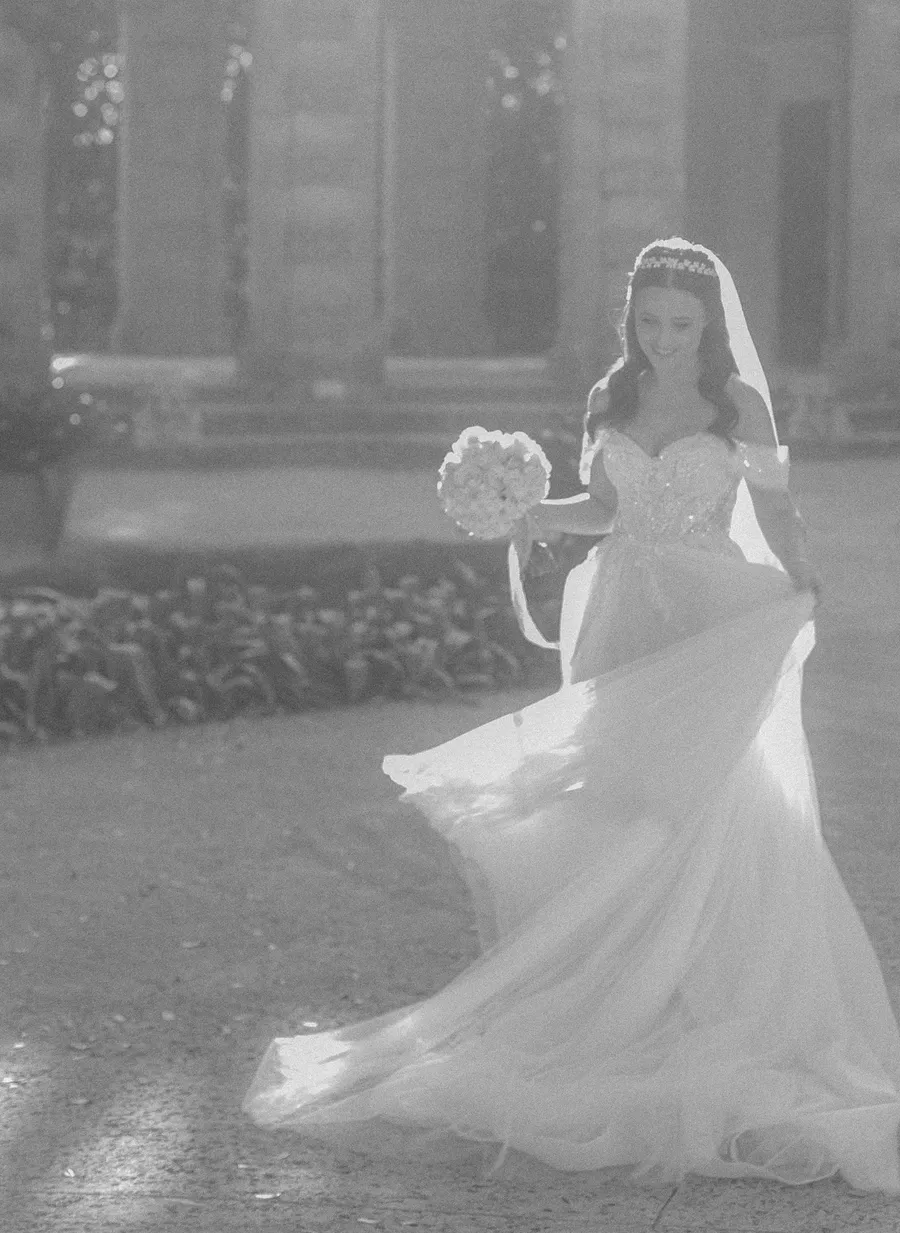 Bride posing in an elegant historic courtyard — Steven and Iryna wedding