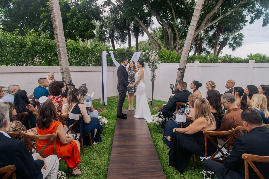 Black-and-white candid from the outdoor ceremony — Chris and Laura wedding
