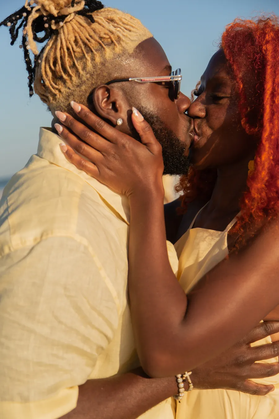 Close portrait of a couple sharing a kiss at the beach