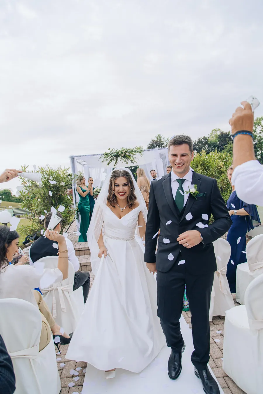 Groom and friends sharing a candid outdoor moment — Mattia and Yulia wedding