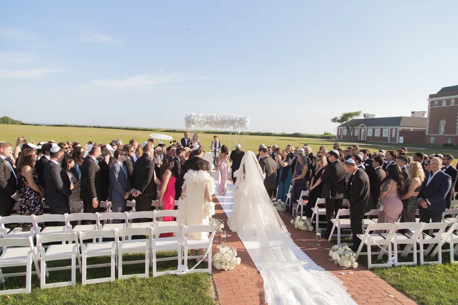 Bride walking down the outdoor ceremony aisle — David and Katia wedding