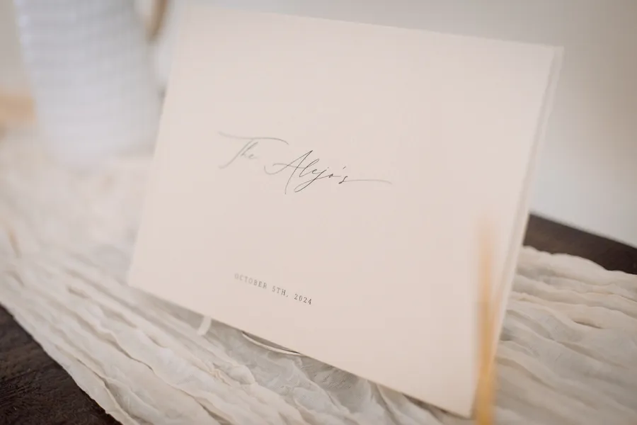 Wedding invitation and paper detail in soft light — Chris and Laura wedding