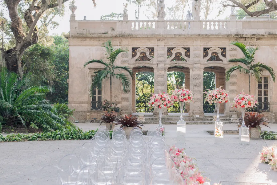 Bride walking through the floral ceremony aisle — Steven and Iryna wedding