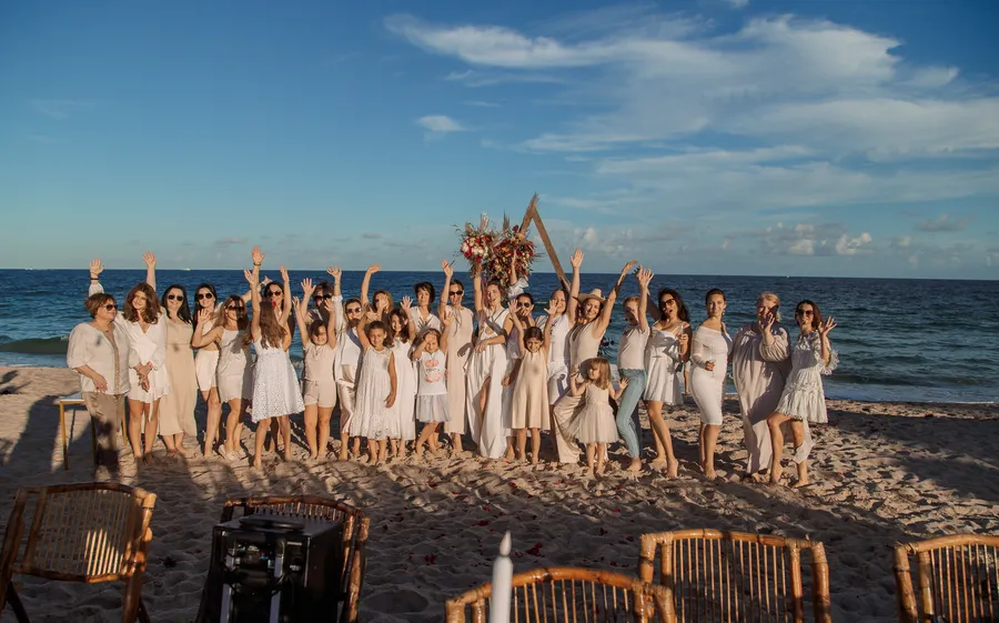 Large wedding group portrait beside the ocean — Roman and Victoria wedding