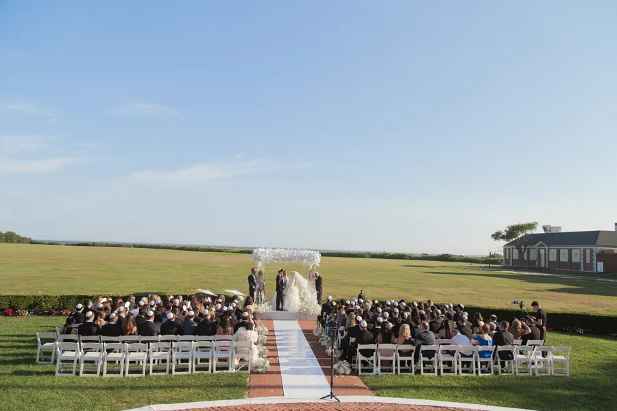 Wedding guests watching the couple exchange vows — David and Katia wedding