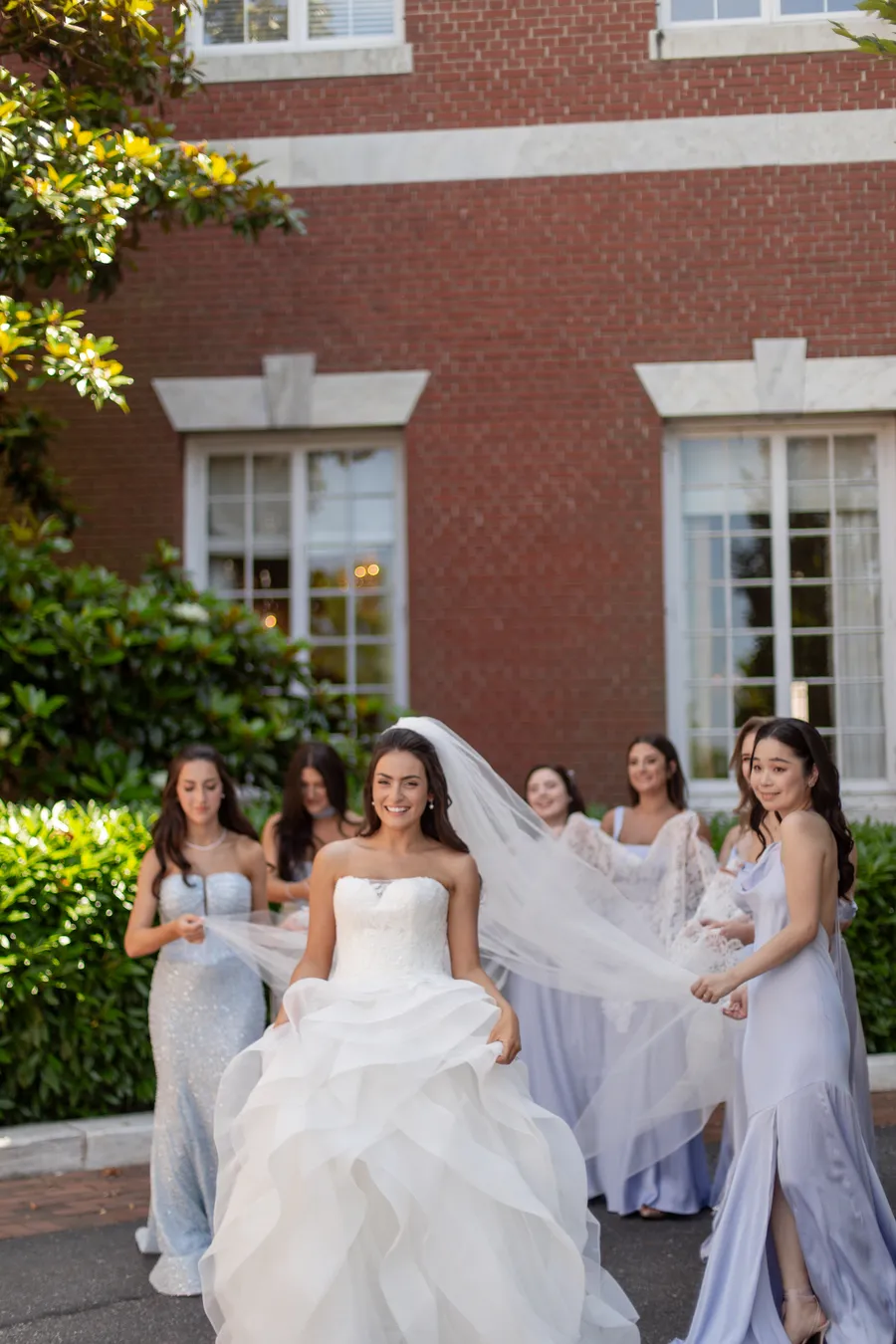 Bride and bridesmaids celebrating outside the estate — David and Katia wedding