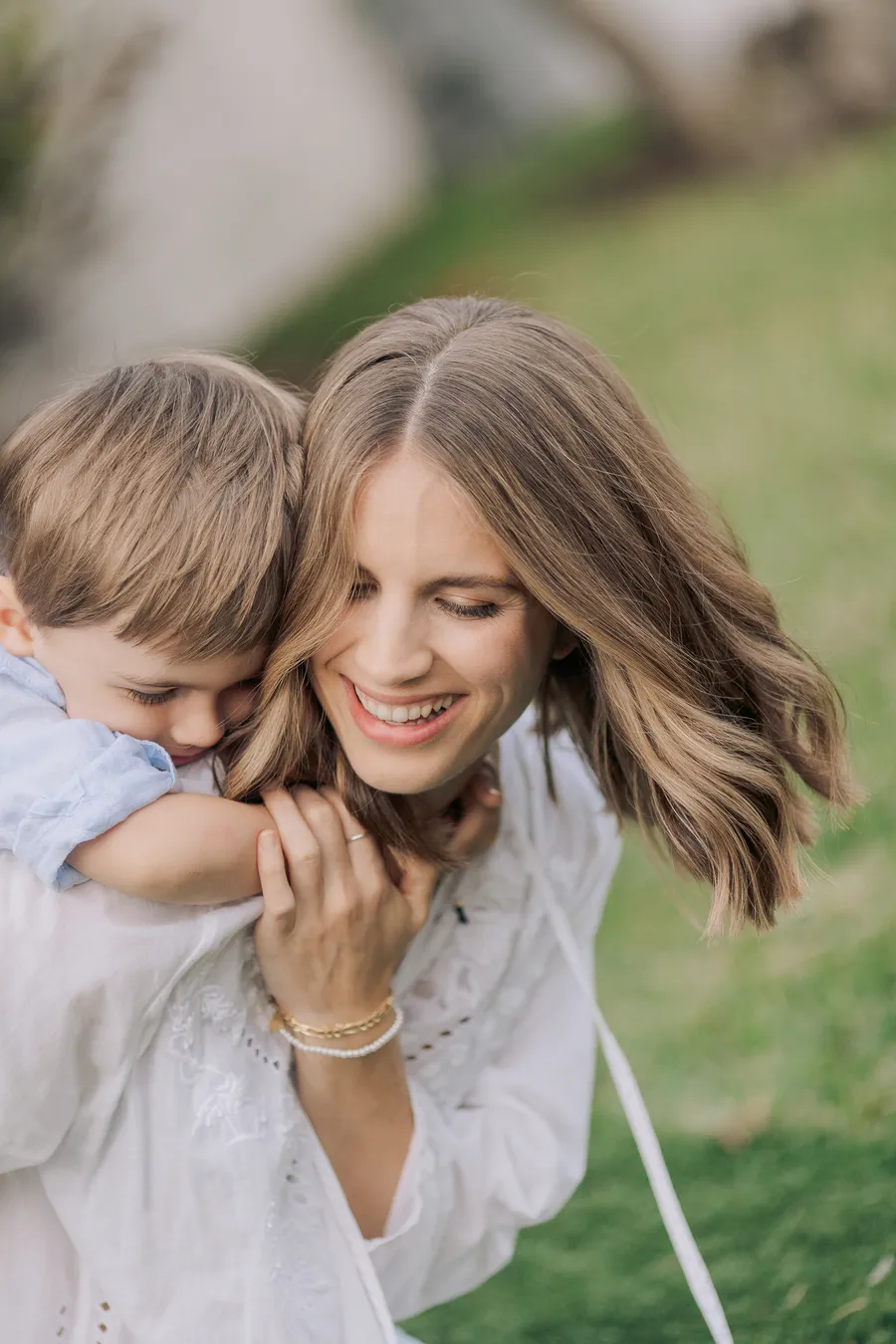 Mother and daughter laughing together during an outdoor session