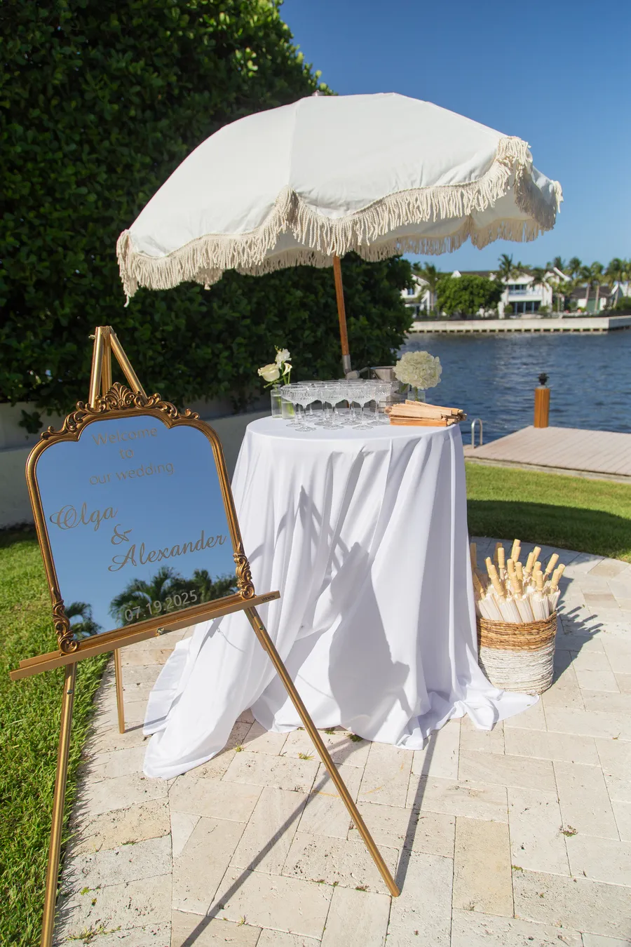 Bride getting ready beside a waterfront pool — Alexander and Olga wedding