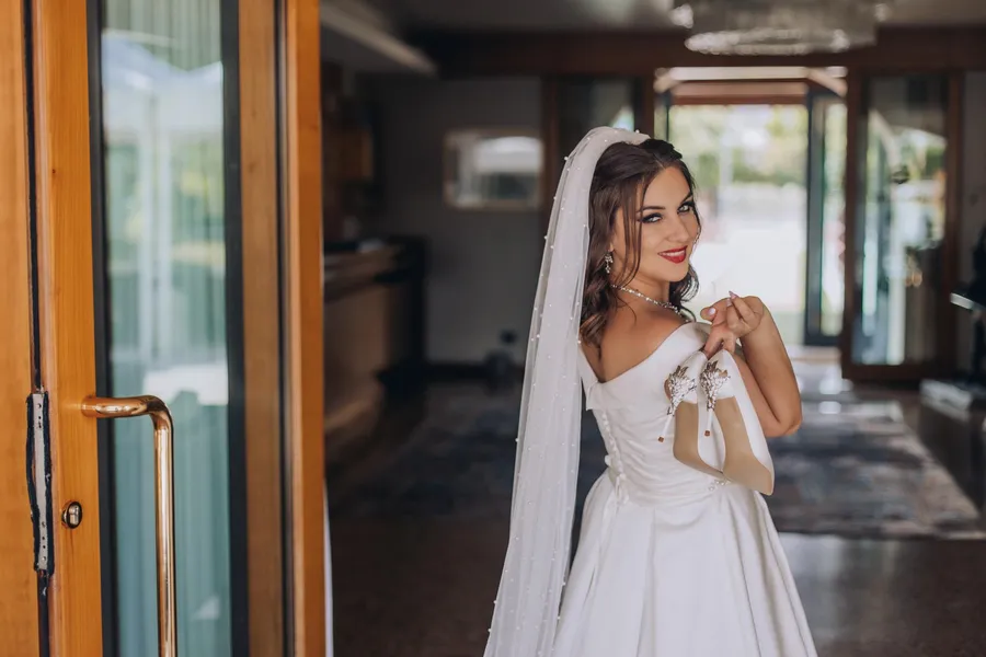 Bride and attendants sharing a candid preparation moment — Mattia and Yulia wedding