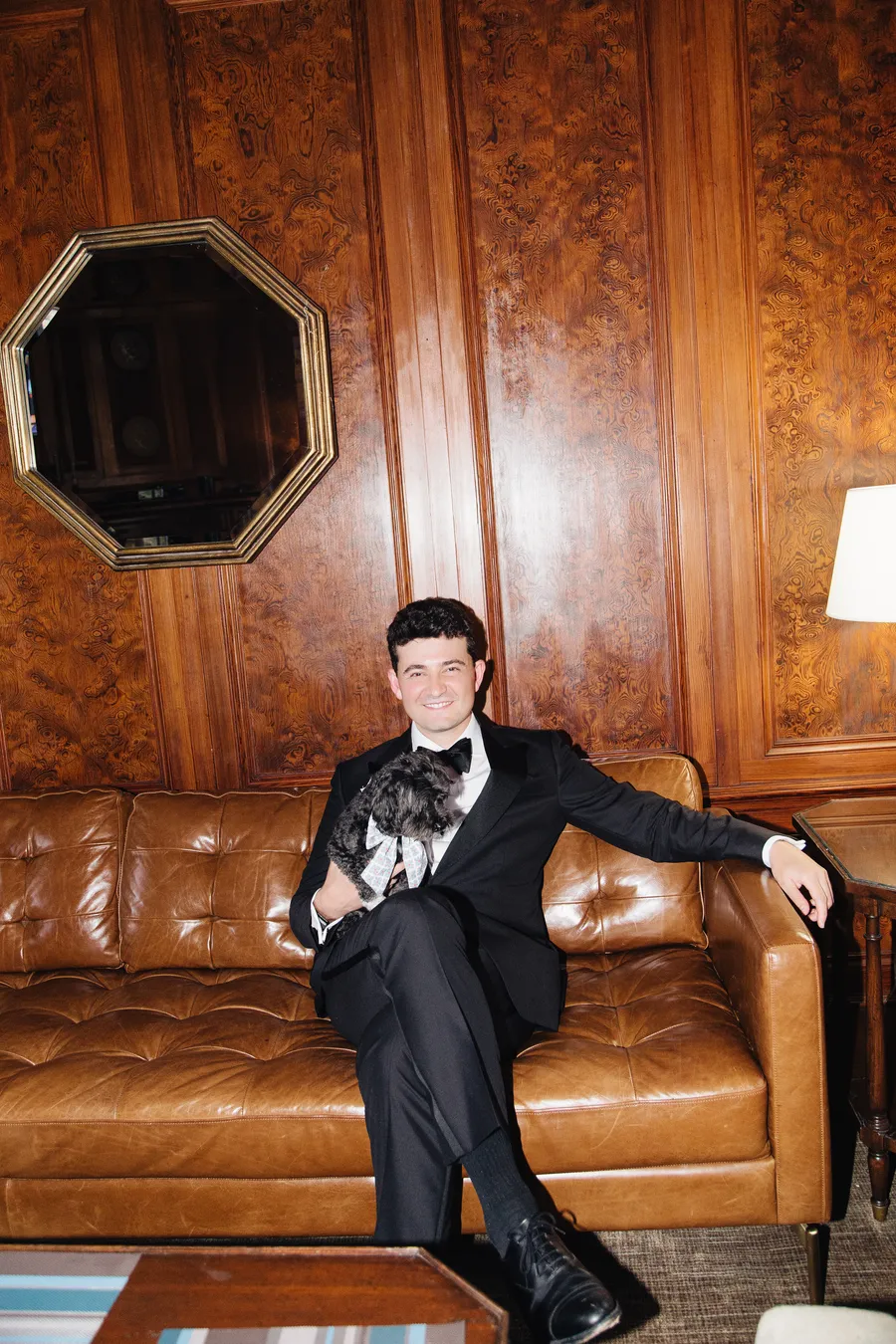 Groom portrait in a wood-paneled library — David and Katia wedding