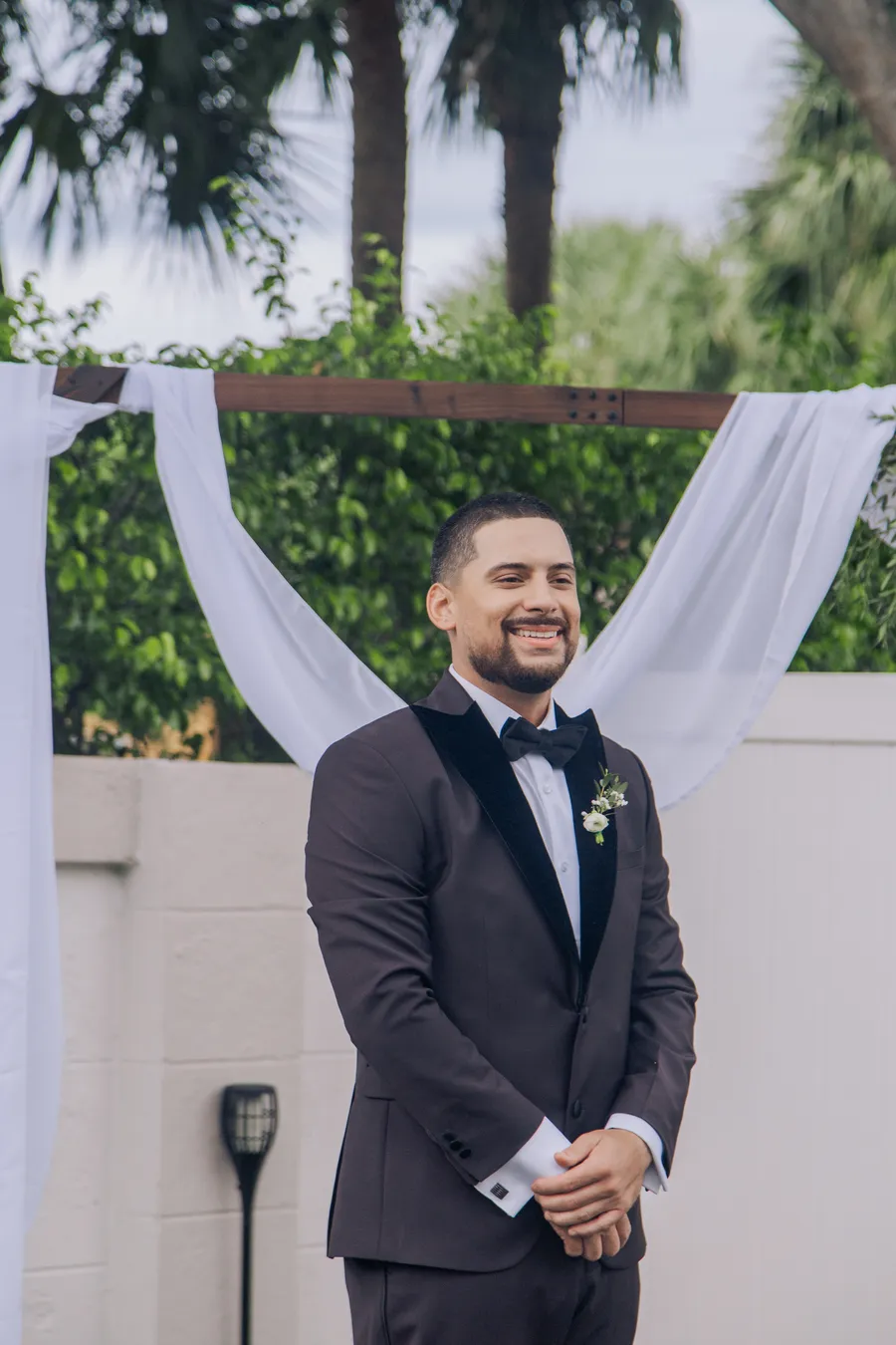 Bride walking toward the garden ceremony — Chris and Laura wedding