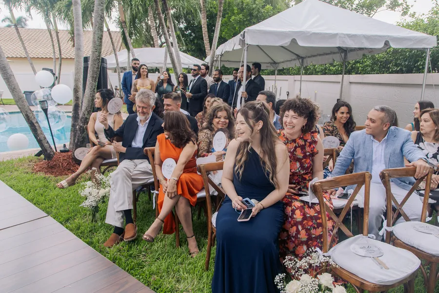 Guests seated for an intimate outdoor wedding ceremony — Chris and Laura wedding