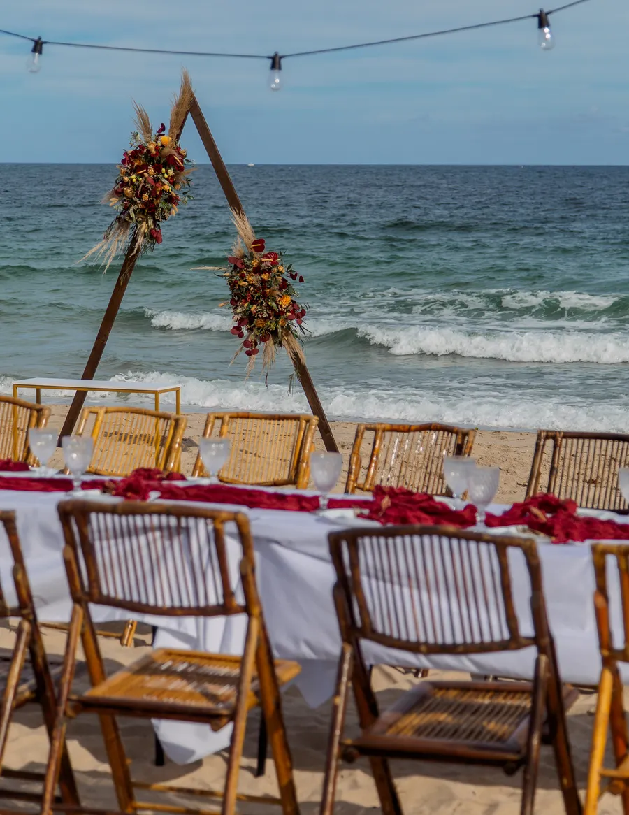 Beach wedding ceremony setup overlooking turquoise water — Roman and Victoria wedding