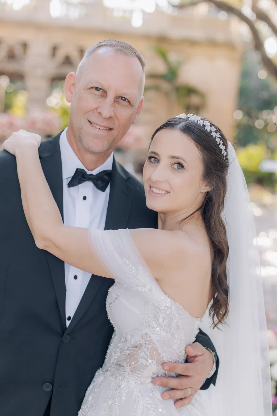Newlyweds embracing after their garden ceremony — Steven and Iryna wedding