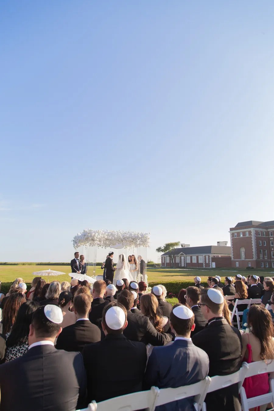 Bride walking down the outdoor ceremony aisle — David and Katia wedding