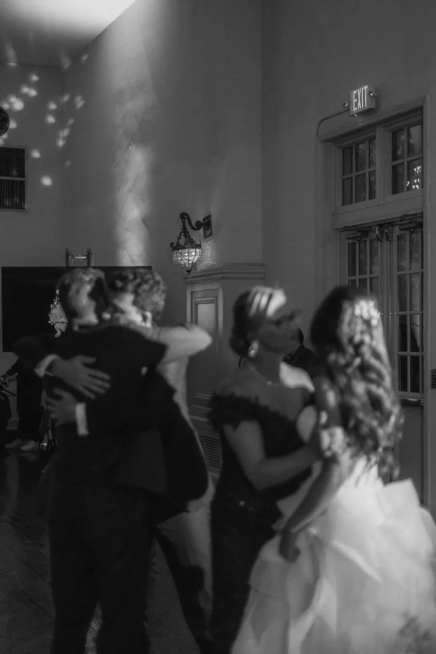 Bride and groom dancing beneath warm reception lights — David and Katia wedding