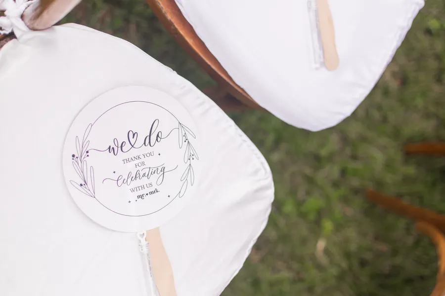 Outdoor ceremony aisle prepared beneath tropical trees — Chris and Laura wedding