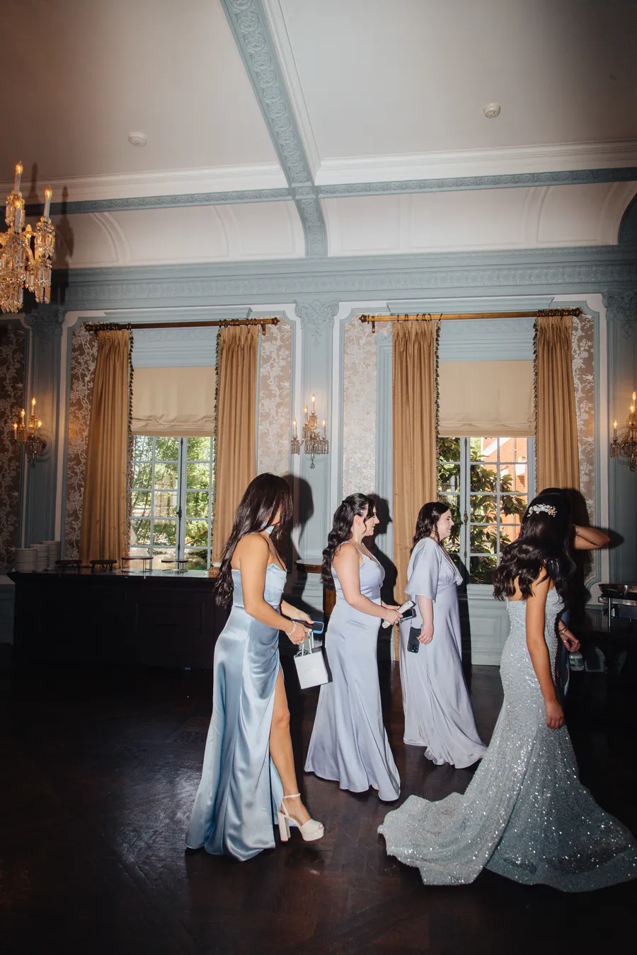 Bride and bridesmaids inside an elegant historic room — David and Katia wedding