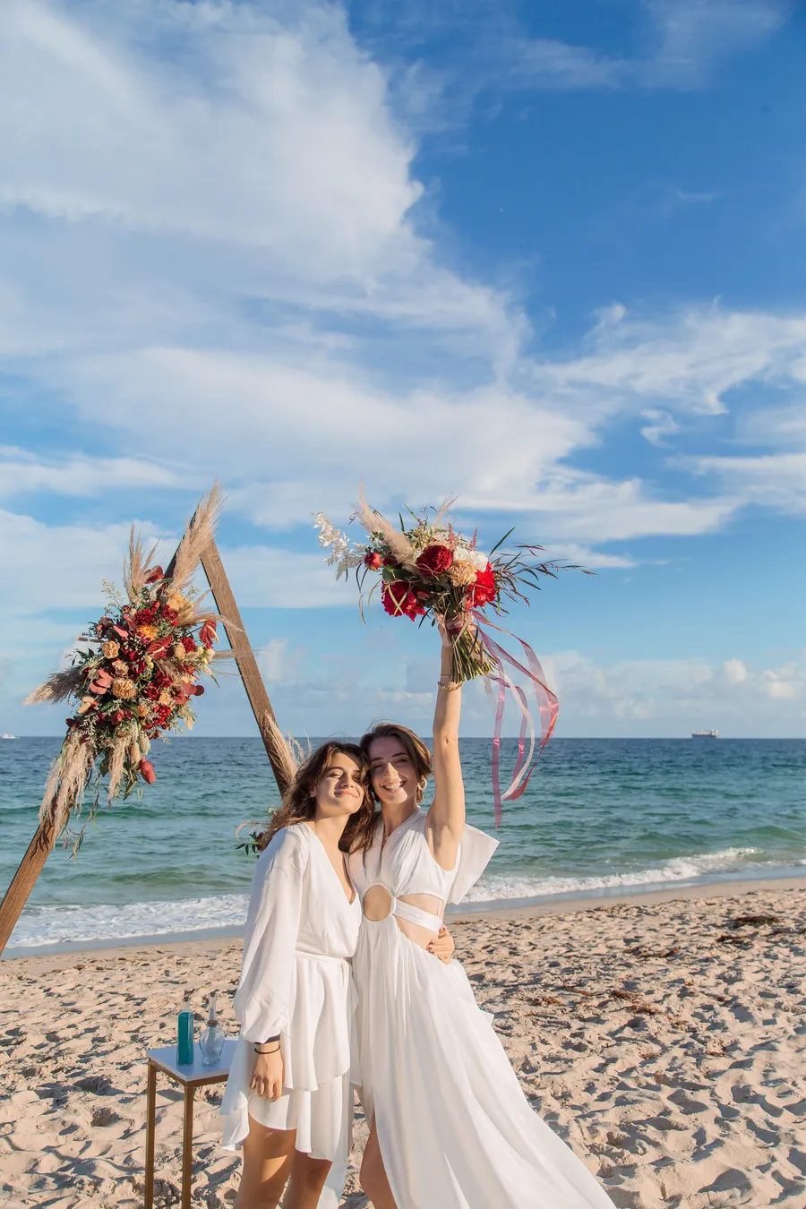 Bride and groom sharing a joyful beach portrait — Roman and Victoria wedding