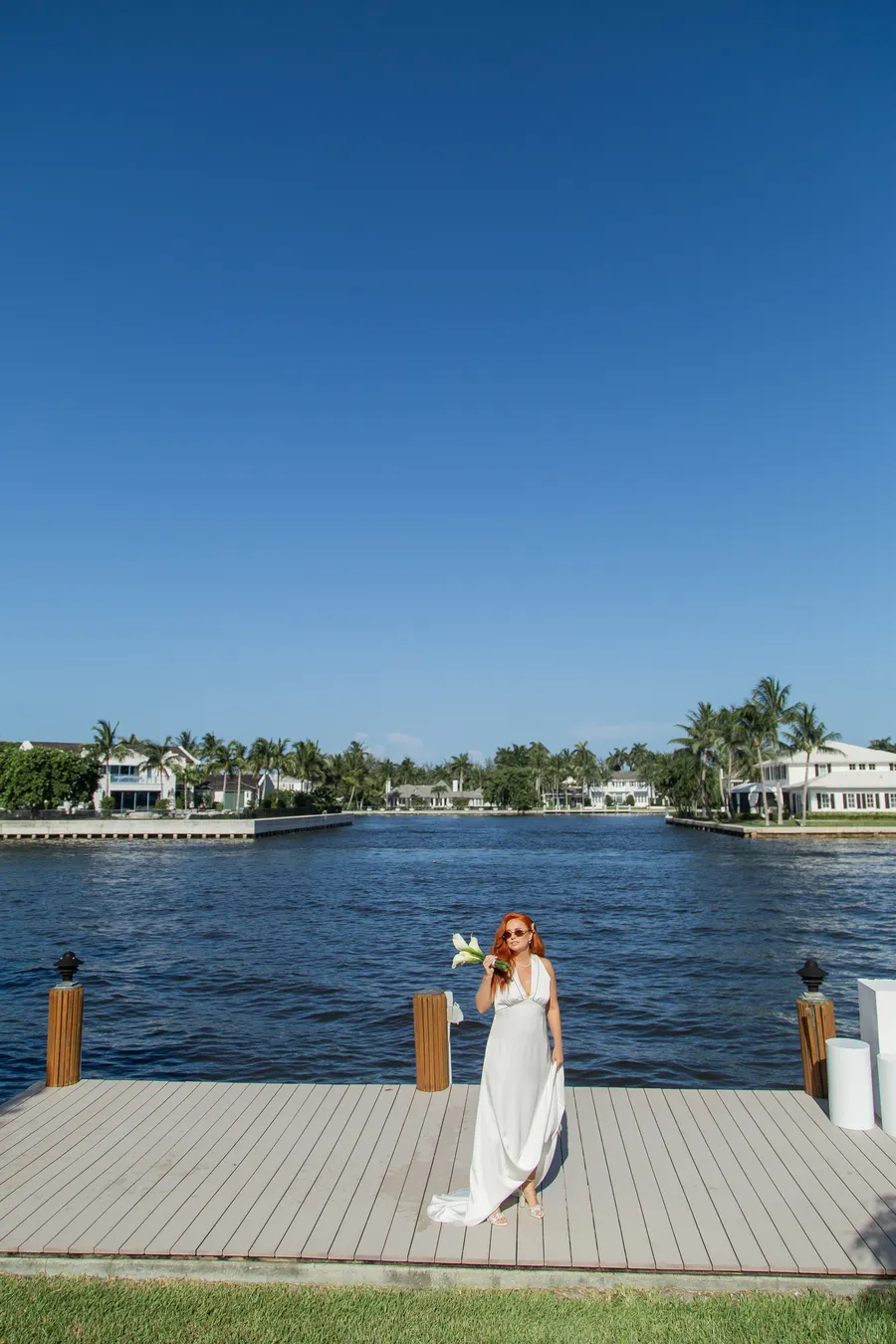 Newlyweds holding hands beside the water — Alexander and Olga wedding