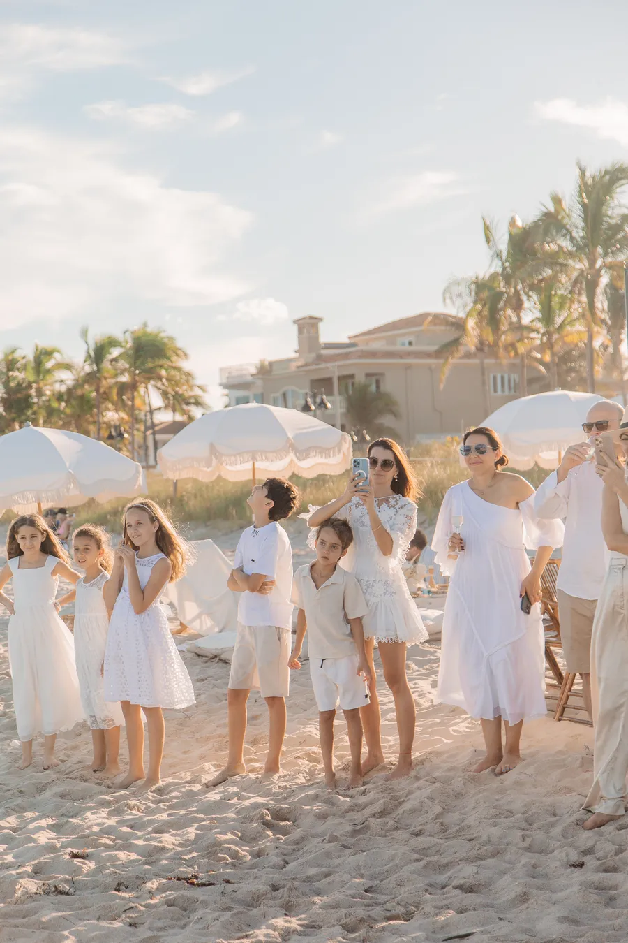 Large wedding group portrait beside the ocean — Roman and Victoria wedding