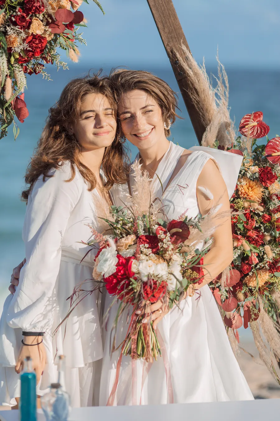 Bride and family preparing beside the ocean — Roman and Victoria wedding