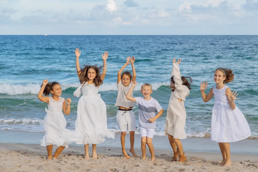 Family and friends gathering for an oceanfront wedding — Roman and Victoria wedding