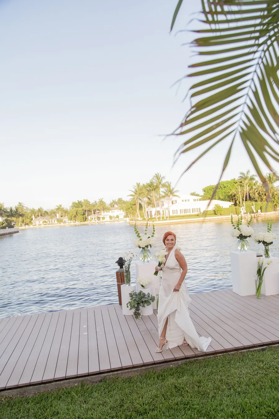 Bride and groom celebrating beside the waterfront ceremony — Alexander and Olga wedding