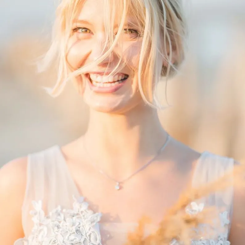 Portrait of Sarasota photographer Natali Terentieva smiling outdoors