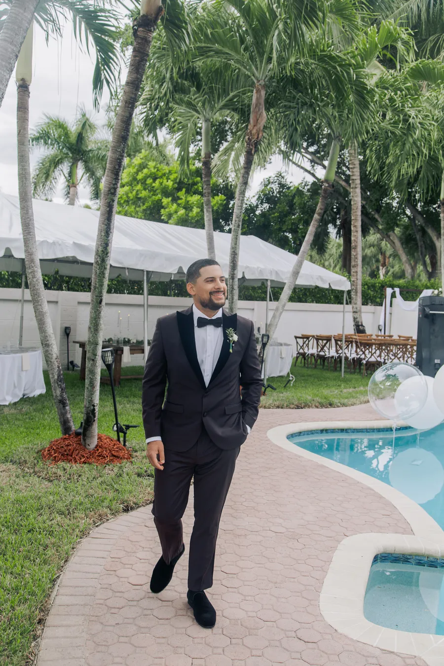 Groom boutonniere with white flowers and greenery — Chris and Laura wedding