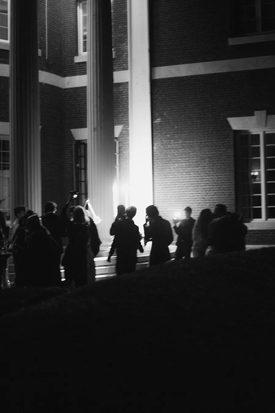 Black-and-white candid from the wedding reception — David and Katia wedding